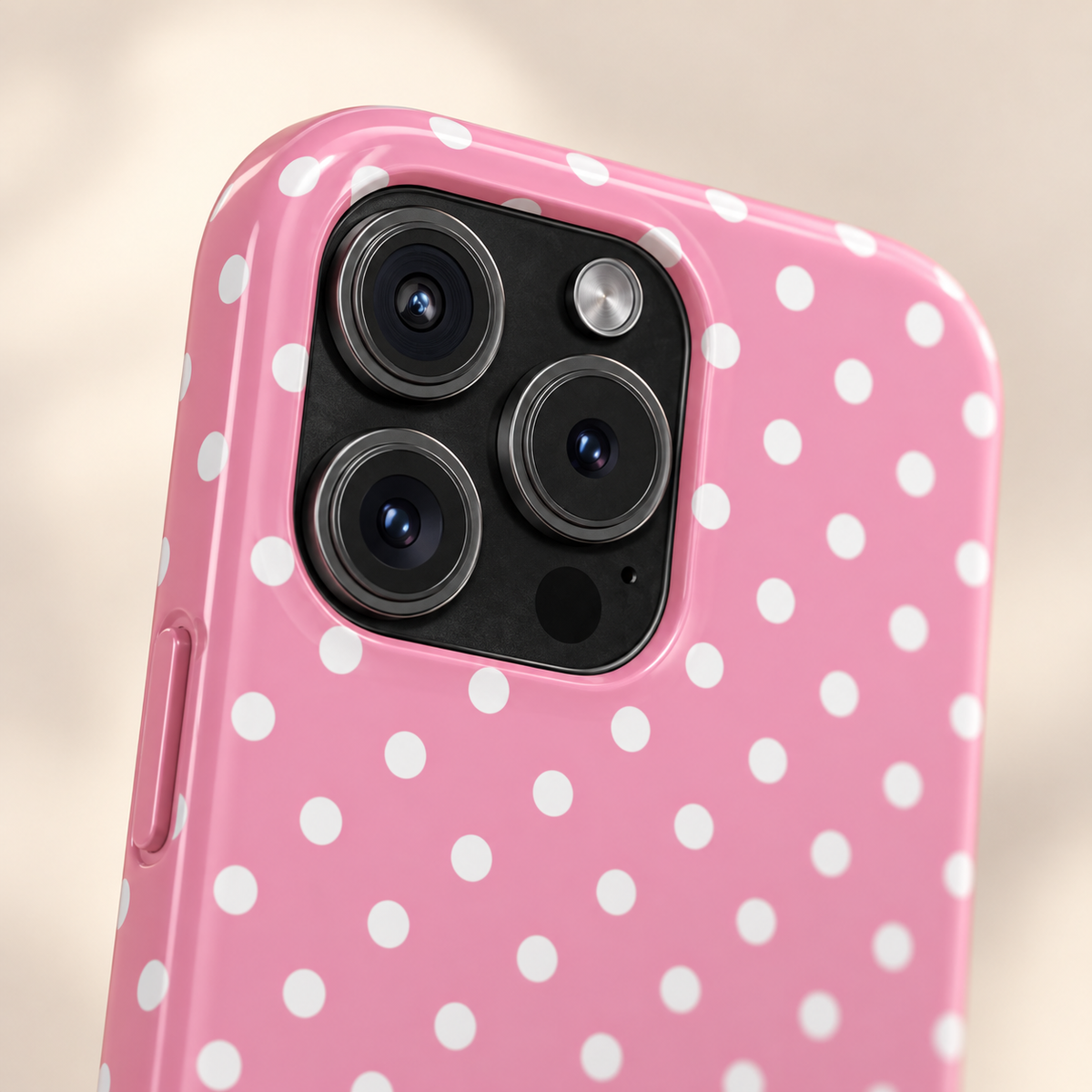 Polka Party phone case with card holder, bold white polka dots on pink, lifestyle close-up of the camera