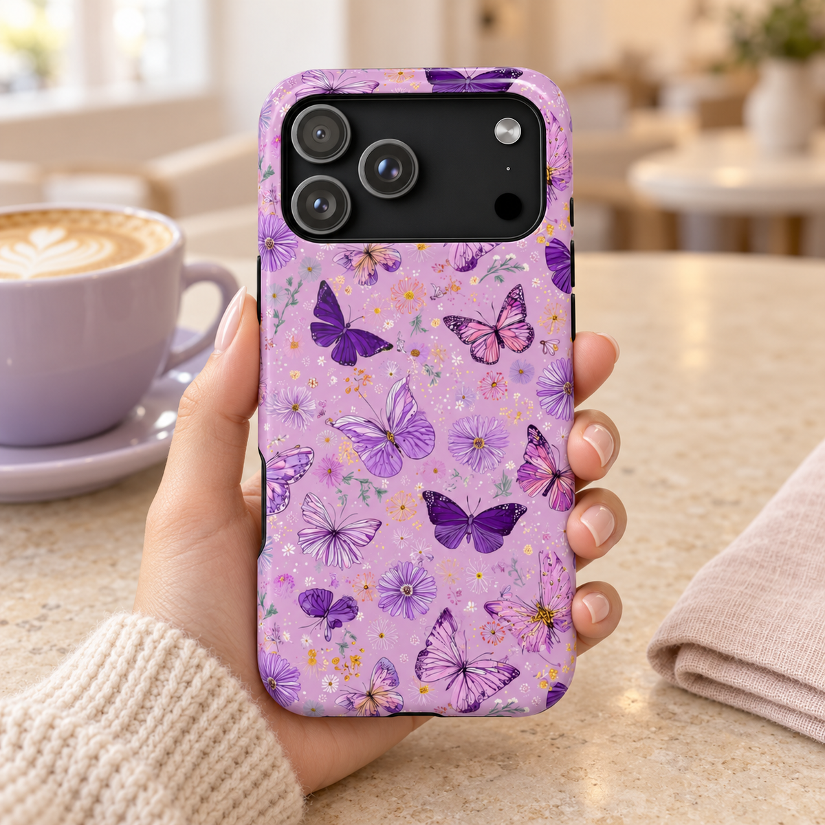 Purple Butterfly protective phone case, purple butterflies on lilac, lifestyle photo in hand with coffee