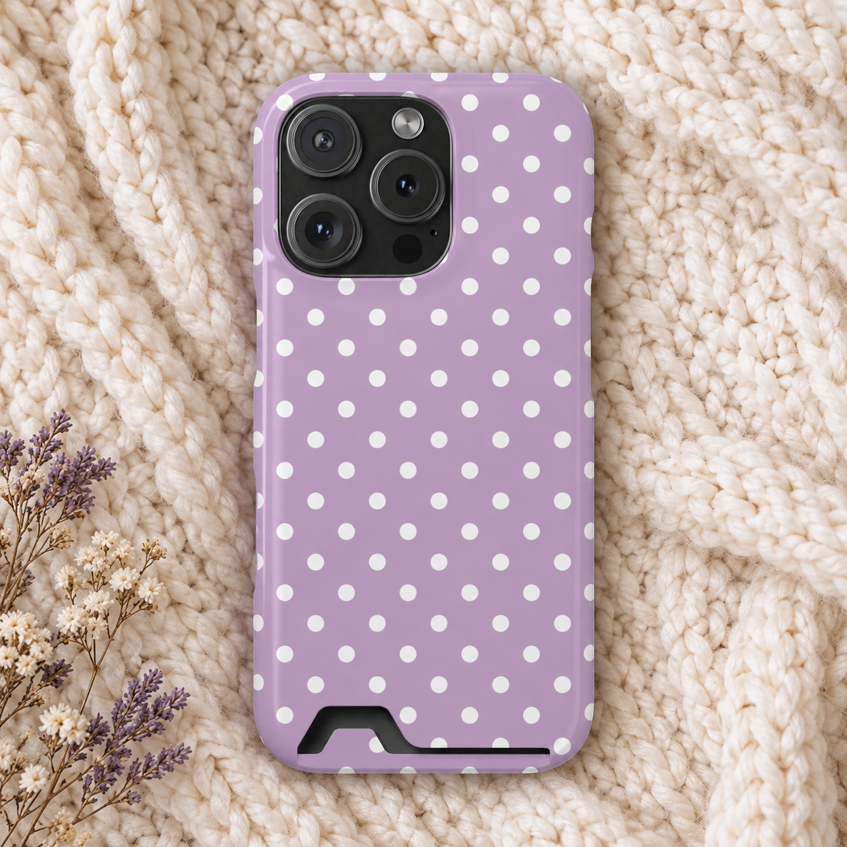 Purple Polka Dot phone case with card holder, white polka dots on purple, lifestyle photo on a knit blanket