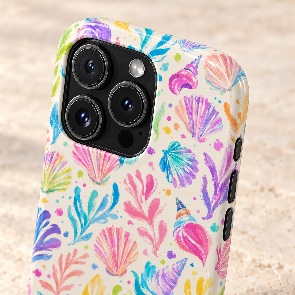 Rainbow Reef phone case with card holder, rainbow seashells and coral on cream, lifestyle close-up of the camera