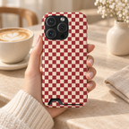 Red Checkered phone case with card holder, a red and cream checkerboard, lifestyle photo in hand with coffee