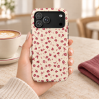 Red Ditsy Floral MagSafe case, tiny red flowers on cream, lifestyle photo in hand with coffee