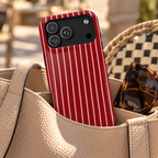 Red Pinstripe protective phone case, white pinstripes on cherry red, lifestyle photo in a handbag