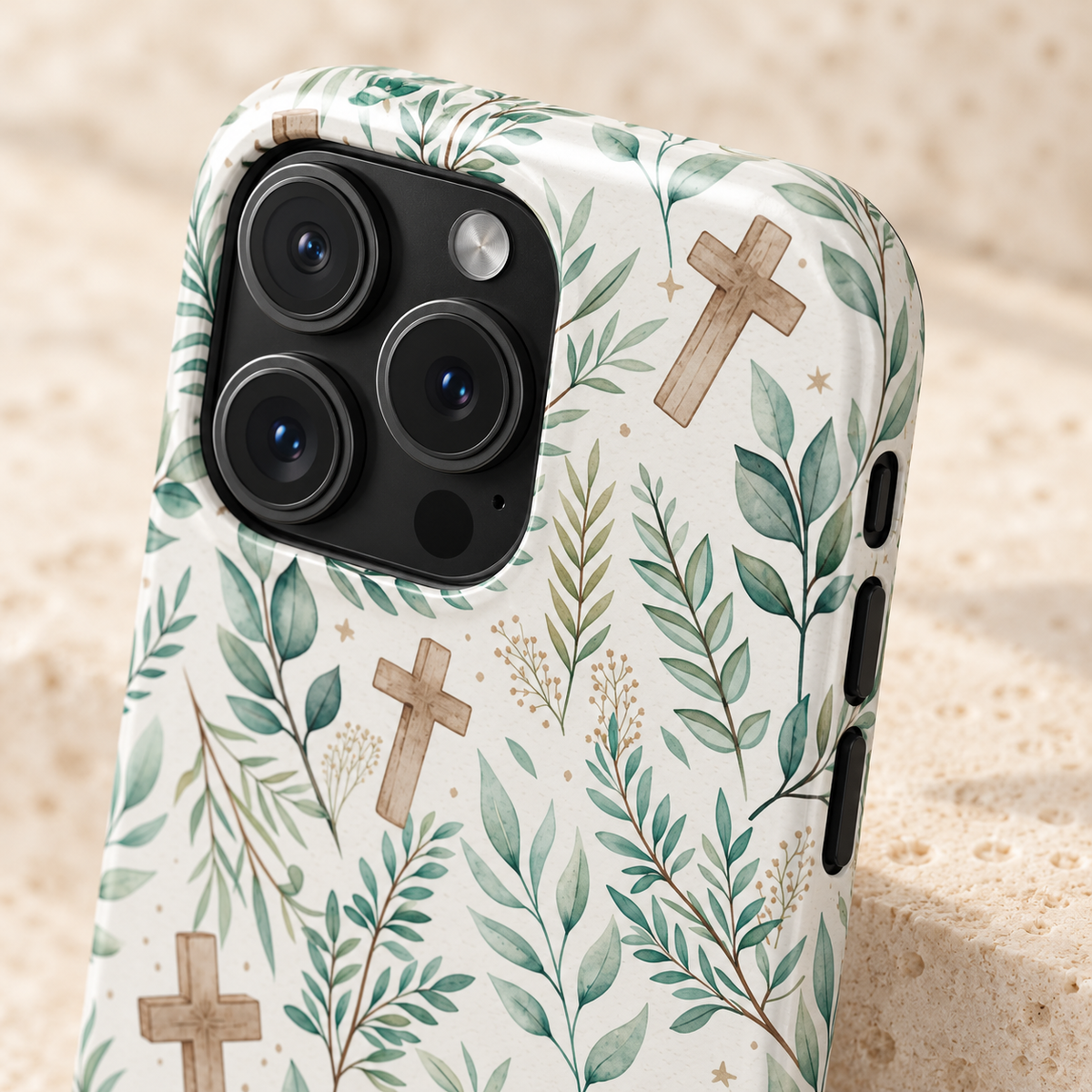 Sage Cross phone case with card holder, wooden crosses among sage leaves on cream, lifestyle close-up of the camera