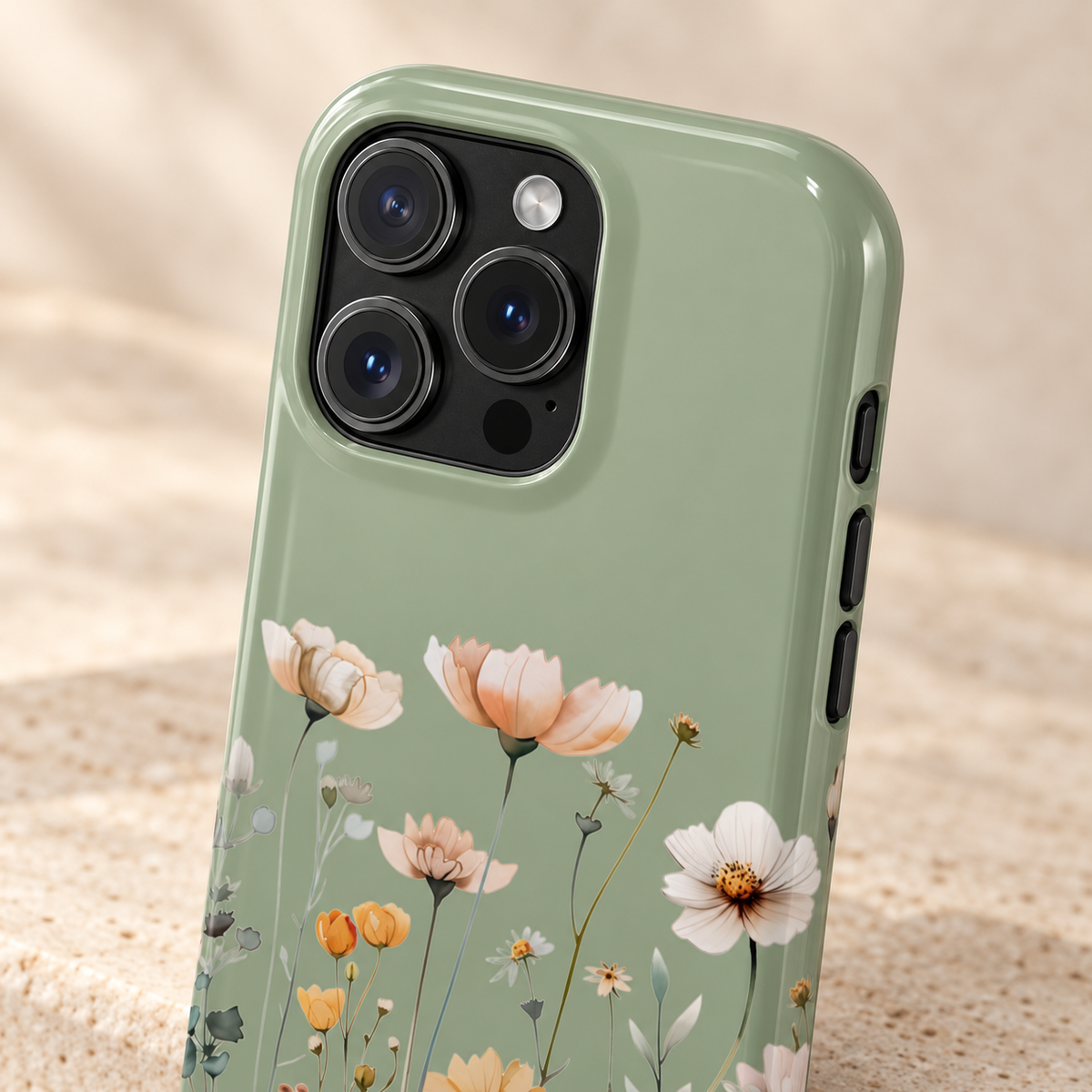 Sage Daisy phone case with card holder, white daisies and tiny blooms on sage green, lifestyle close-up of the camera