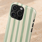 Sage Stripe MagSafe case, sage green and cream stripes, lifestyle close-up of the camera