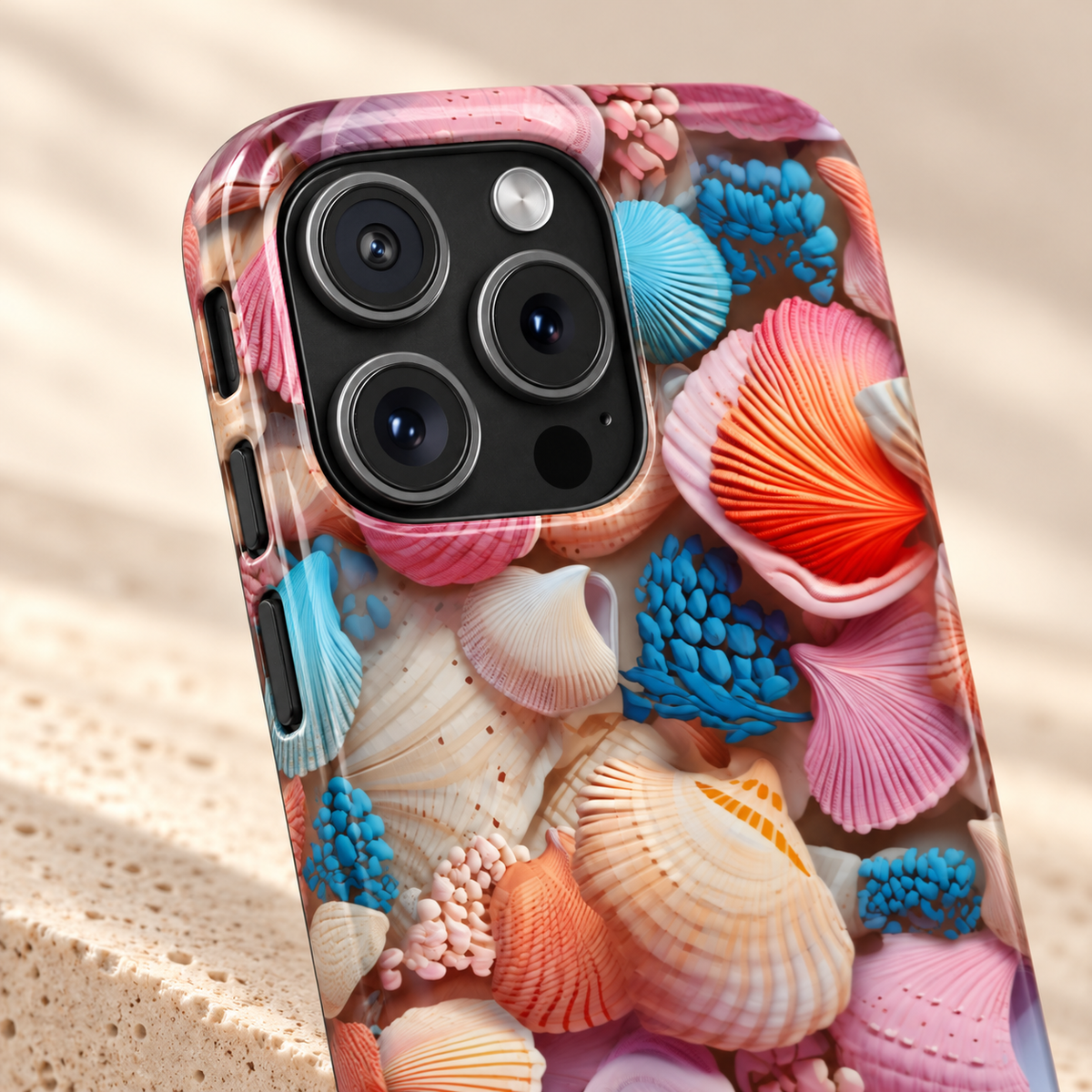 Seashell Treasure MagSafe case, a pile of colorful seashells, lifestyle close-up of the camera