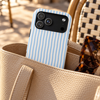 Sky Blue Stripe MagSafe case, sky blue and white stripes, lifestyle photo in a handbag
