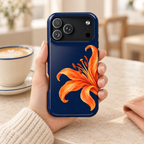 Tiger Lily protective phone case, an orange tiger lily on deep navy, lifestyle photo in hand with coffee