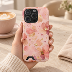 Watercolor Blossom phone case with card holder, blush watercolor blossoms with gold flecks, lifestyle photo in hand with coffee